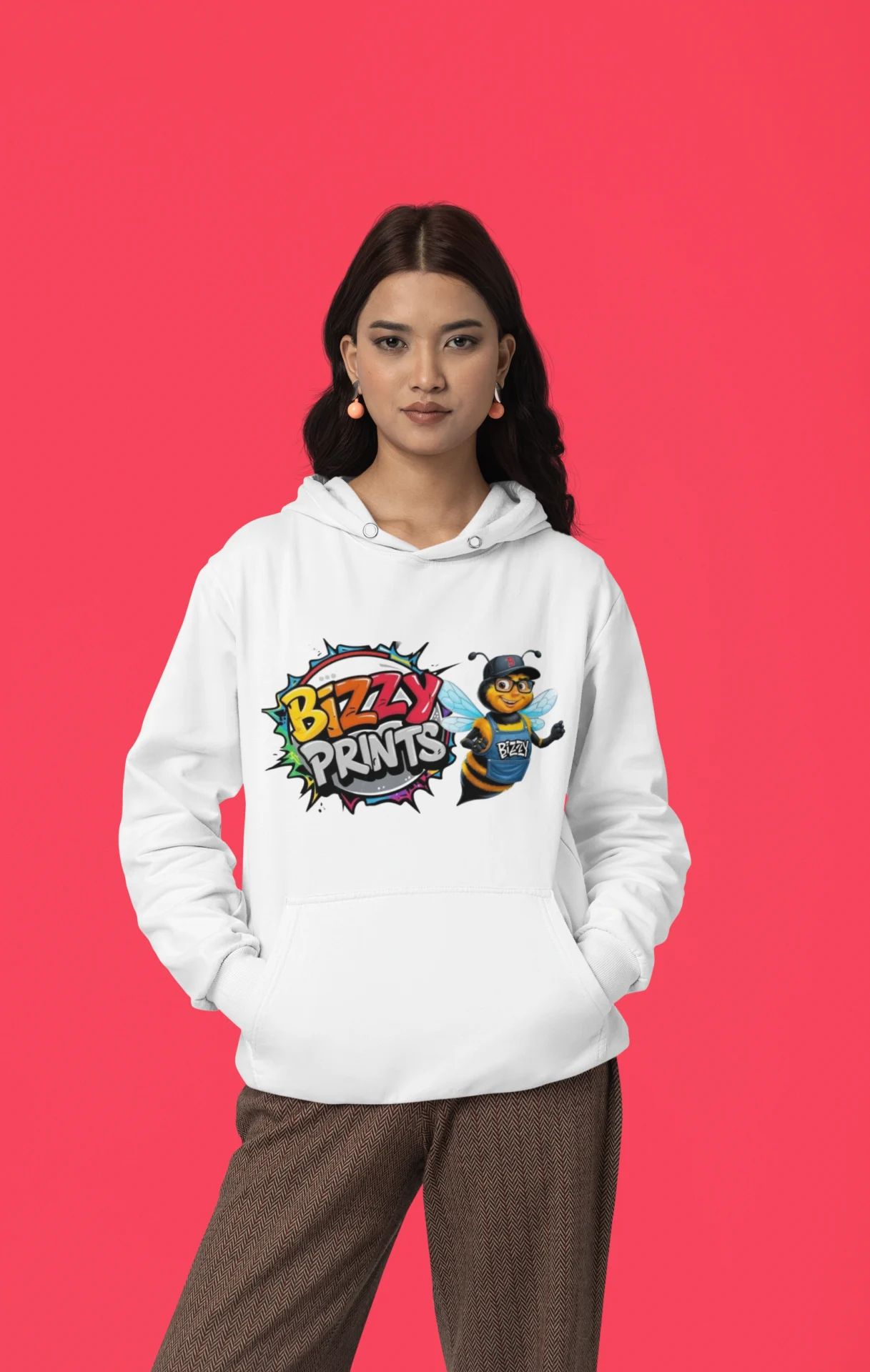 Woman wearing a white hoodie with a colorful 'Bizzy Prints' graphic.