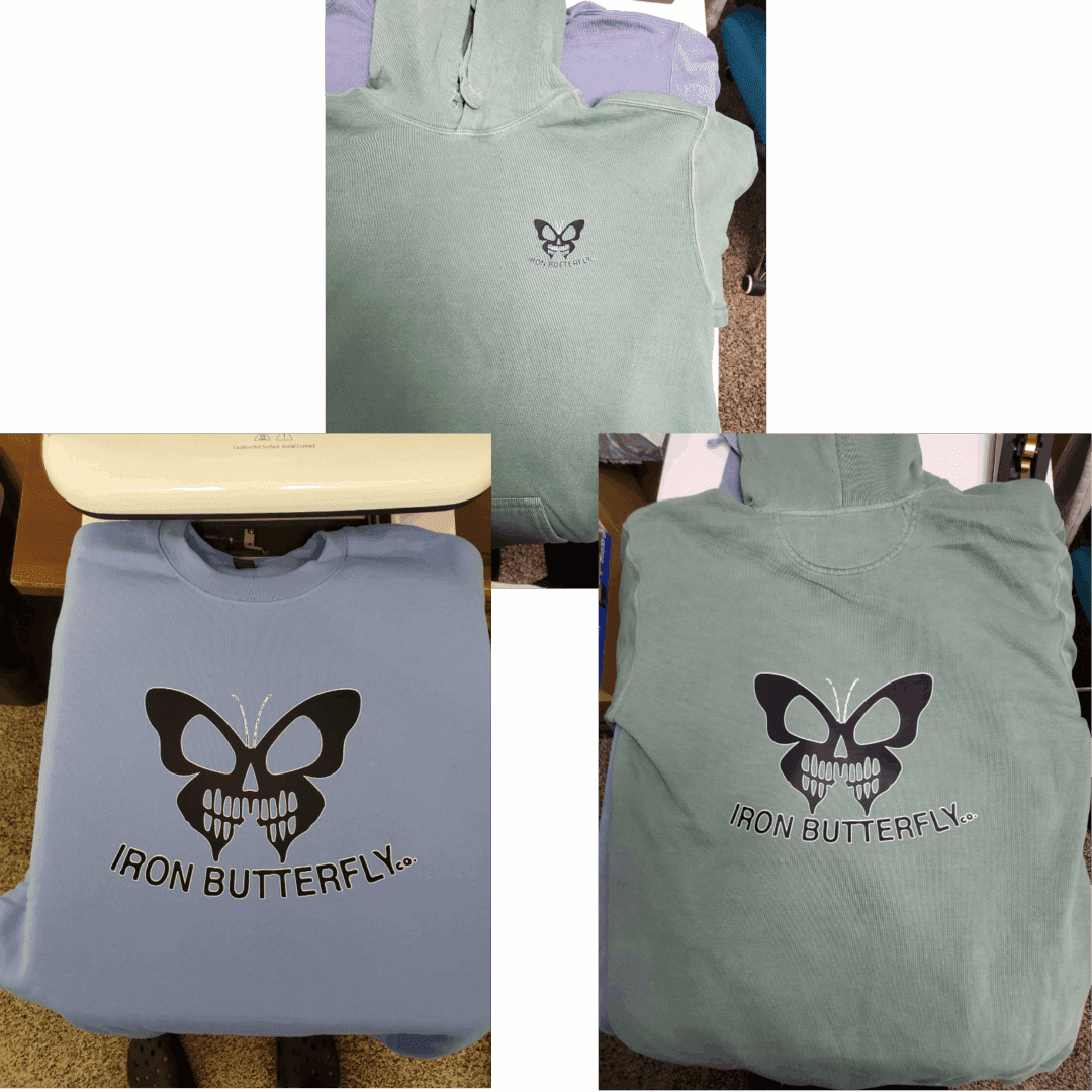 Two green t-shirts with a black butterfly logo and "IRON BUTTERFLY" text.