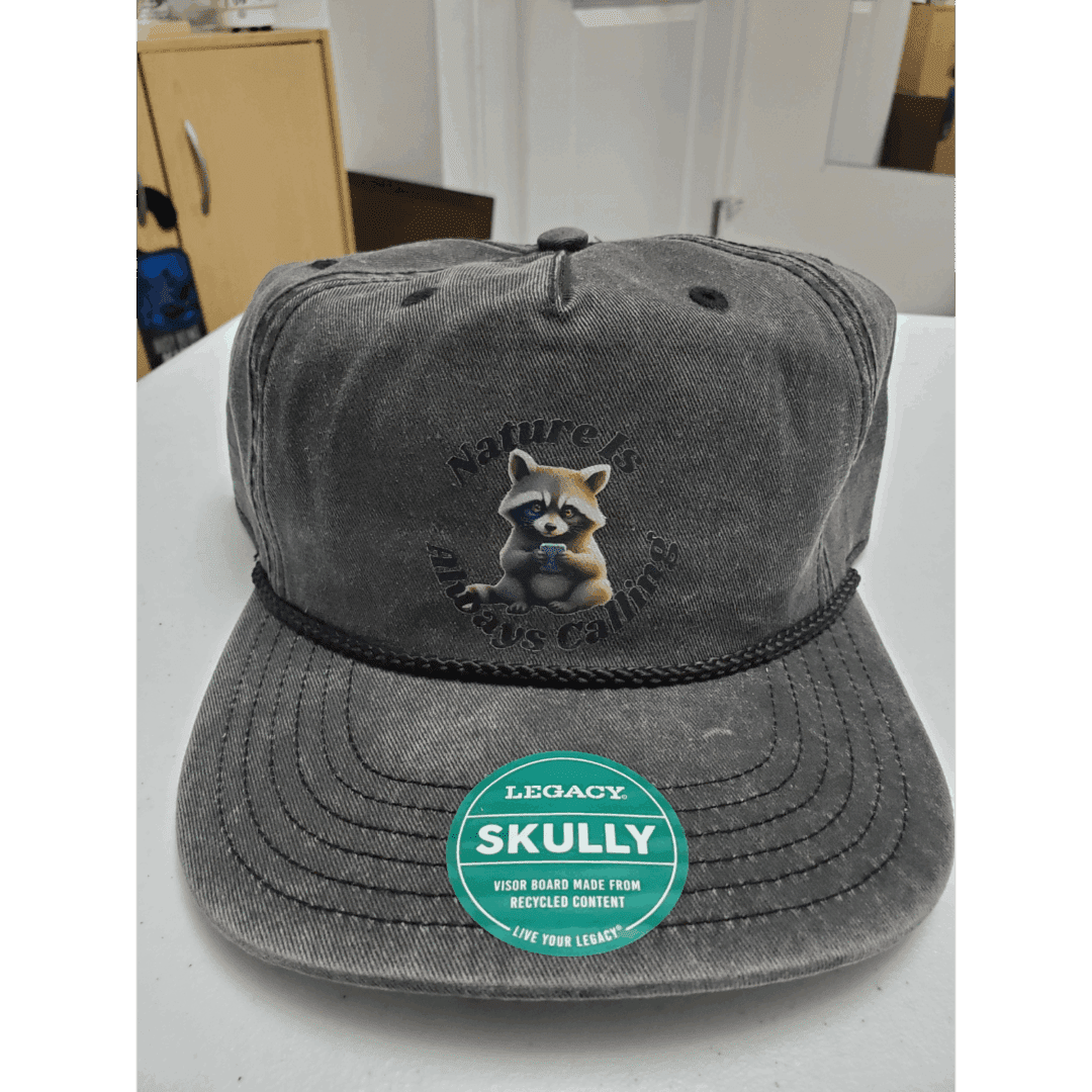A gray baseball cap with a raccoon embroidered on the front.