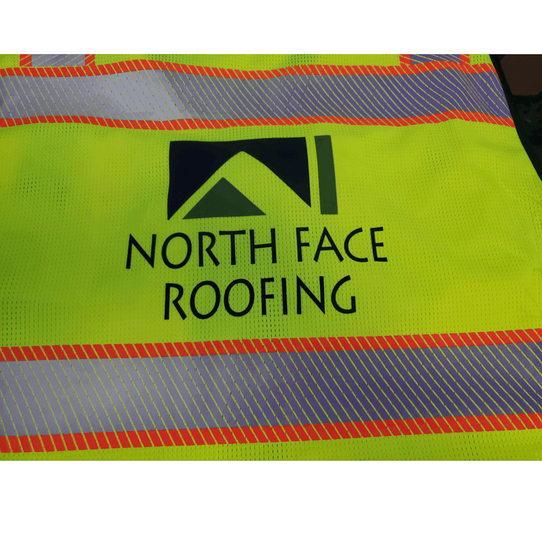 High-visibility safety vest with North Face Roofing logo.